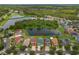 Aerial shot of home, showcasing the backyard, screened-in pool, and view of a peaceful lake at 20115 Nob Oak Ave, Tampa, FL 33647