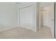 Bedroom featuring carpet flooring, neutral walls, and a closet with white doors at 20115 Nob Oak Ave, Tampa, FL 33647
