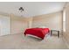 Bedroom with neutral tones, window, and access to additional rooms at 20115 Nob Oak Ave, Tampa, FL 33647