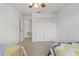 Bedroom featuring carpet floors, a closet with white doors, and neutral walls at 20115 Nob Oak Ave, Tampa, FL 33647