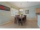 Dining area with seating for six, pendant lighting, and serene backyard view at 20115 Nob Oak Ave, Tampa, FL 33647