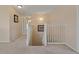 Spacious hallway with carpet, white railings, and access to rooms at 20115 Nob Oak Ave, Tampa, FL 33647