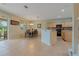 Open-concept kitchen and dining area with a view of the lake at 20115 Nob Oak Ave, Tampa, FL 33647