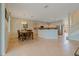 Open kitchen and dining area with stainless steel appliances and access to stairs at 20115 Nob Oak Ave, Tampa, FL 33647