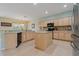 Well-equipped kitchen with stainless steel appliances, island and tiled backsplash at 20115 Nob Oak Ave, Tampa, FL 33647
