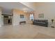 Bright and airy living room with tile flooring, neutral decor, and a chandelier at 20115 Nob Oak Ave, Tampa, FL 33647
