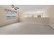 Upstairs loft area with a view and large windows, perfect for relaxing or entertaining at 20115 Nob Oak Ave, Tampa, FL 33647