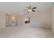 Spacious second floor living area with open railing, view, and ceiling fan at 20115 Nob Oak Ave, Tampa, FL 33647