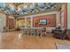 A clubhouse interior with a long dining table, leather armchairs, and unique decorative accents, perfect for gatherings at 20115 Nob Oak Ave, Tampa, FL 33647