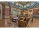 A warm and inviting clubhouse lounge area featuring plush seating, area rug, and ample natural light at 20115 Nob Oak Ave, Tampa, FL 33647