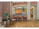 A cozy lounge area in a community clubhouse featuring bar seating, wooden floors, and tasteful decor at 20115 Nob Oak Ave, Tampa, FL 33647