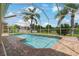 Screened-in pool with brick pavers and relaxing view of the beautiful, calming lake at 20115 Nob Oak Ave, Tampa, FL 33647