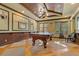 This pool room features an attractive wooden ceiling, and recessed lighting along with a beautiful pool table at 20115 Nob Oak Ave, Tampa, FL 33647