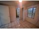 Bright bedroom with tile floors, closet, and a view of a nearby bathroom at 2101 E Ellicott St, Tampa, FL 33610