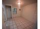 Cozy bedroom with tile floors, closet, and a light and airy ambiance at 2101 E Ellicott St, Tampa, FL 33610