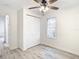 Bright bedroom showcasing a ceiling fan and wood-look flooring at 2101 E Ellicott St, Tampa, FL 33610
