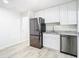 Bright kitchen features stainless steel appliances, granite countertops, and ample cabinet space at 2101 E Ellicott St, Tampa, FL 33610