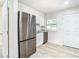 Modern kitchen features stainless steel appliances, granite countertops, and ample cabinet space at 2101 E Ellicott St, Tampa, FL 33610