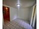 A bright, empty room with tiled floors and fresh paint at 2101 E Ellicott St, Tampa, FL 33610