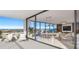 Bright condo balcony features patio furniture and city views leading into a modern dining and living space at 235 1St S Ave # 3501, St Petersburg, FL 33701