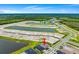 Drone shot of the property with a view of the surrounding neighborhood at 2743 Winding Creek Trl, North Port, FL 34289