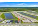 Aerial view of the home and the surrounding lake community at 2743 Winding Creek Trl, North Port, FL 34289