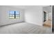 Bright bedroom features soft carpet, a window view, and ensuite access, ideal for relaxation at 2743 Winding Creek Trl, North Port, FL 34289