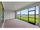 Screened-in lanai offers beautiful views of the lake and manicured lawn at 2743 Winding Creek Trl, North Port, FL 34289