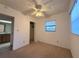 Bedroom featuring a ceiling fan, carpet, window with blinds and a closet at 3234 37Th N St, St Petersburg, FL 33713