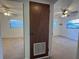 View of two bedrooms with matching carpet, ceilings fans, and window blinds at 3234 37Th N St, St Petersburg, FL 33713