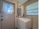 Functional laundry area with washer, dryer, and a utility sink for added convenience at 3234 37Th N St, St Petersburg, FL 33713