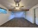 Living room featuring carpeted floors, a ceiling fan, and natural light at 3234 37Th N St, St Petersburg, FL 33713