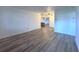 Spacious living room featuring wood panel walls and ceiling fans, seamlessly flowing into other rooms at 3234 37Th N St, St Petersburg, FL 33713
