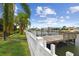A private dock with a white picket fence and beautiful waterfront views at 3921 E Eden Roc Cir, Tampa, FL 33634
