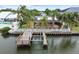 Waterfront property with a private dock and boat lift, offering direct access to the open water at 3921 E Eden Roc Cir, Tampa, FL 33634