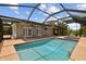 Large screened pool with integrated spa and expansive patio creates an ideal outdoor entertainment space at 3921 E Eden Roc Cir, Tampa, FL 33634