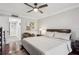 Relaxing bedroom featuring a ceiling fan, hardwood floors, and neutral decor at 4104 Northmeadow Cir # 4104, Tampa, FL 33618