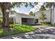 Modern home with a covered carport, xeriscaped yard and mature shade trees at 4104 Northmeadow Cir # 4104, Tampa, FL 33618