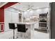 Modern kitchen with white cabinets, granite countertops, stainless steel appliances, and a center island at 4104 Northmeadow Cir # 4104, Tampa, FL 33618