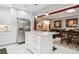 Bright kitchen with a marble countertop island, stainless steel appliances, and modern cabinets at 4104 Northmeadow Cir # 4104, Tampa, FL 33618