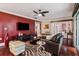 Inviting living room featuring hardwood floors, a ceiling fan, and a plush leather sofa at 4104 Northmeadow Cir # 4104, Tampa, FL 33618