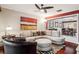 Comfortable living room with hardwood floors, sectional sofa, ceiling fan and a view into the dining room at 4104 Northmeadow Cir # 4104, Tampa, FL 33618