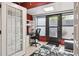 Bright office space with a built-in desk, natural light, and decorative rug at 4104 Northmeadow Cir # 4104, Tampa, FL 33618