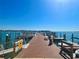 Community dock with boat slips offering direct access to the waterway under a clear sky at 4900 Brittany S Dr # 1011, St Petersburg, FL 33715