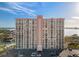A high-rise condo building with many balconies overlooking beautiful blue skies and calm water at 4900 Brittany S Dr # 1011, St Petersburg, FL 33715