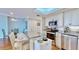 An open concept kitchen with modern stainless steel appliances and eat in kitchen at 4900 Brittany S Dr # 1011, St Petersburg, FL 33715