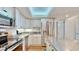 A modern kitchen design with stainless steel appliances, ample storage, and bright lighting at 4900 Brittany S Dr # 1011, St Petersburg, FL 33715