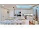 An updated modern kitchen features stainless steel appliances, wood flooring, and bright lighting at 4900 Brittany S Dr # 1011, St Petersburg, FL 33715