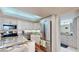 Well-lit kitchen with stainless steel appliances, granite countertops, and white cabinetry at 4900 Brittany S Dr # 1011, St Petersburg, FL 33715