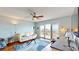An airy living room with a sliding glass door leading to balcony with stunning waterfront views at 4900 Brittany S Dr # 1011, St Petersburg, FL 33715